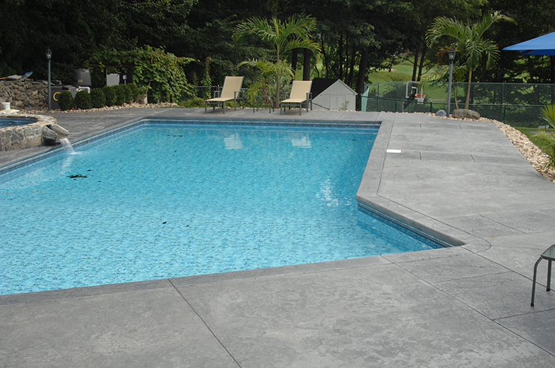 Swimming pool and stamped concrete project example 91
